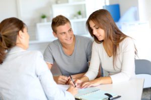 Young couple meeting financial consultant for credit loan